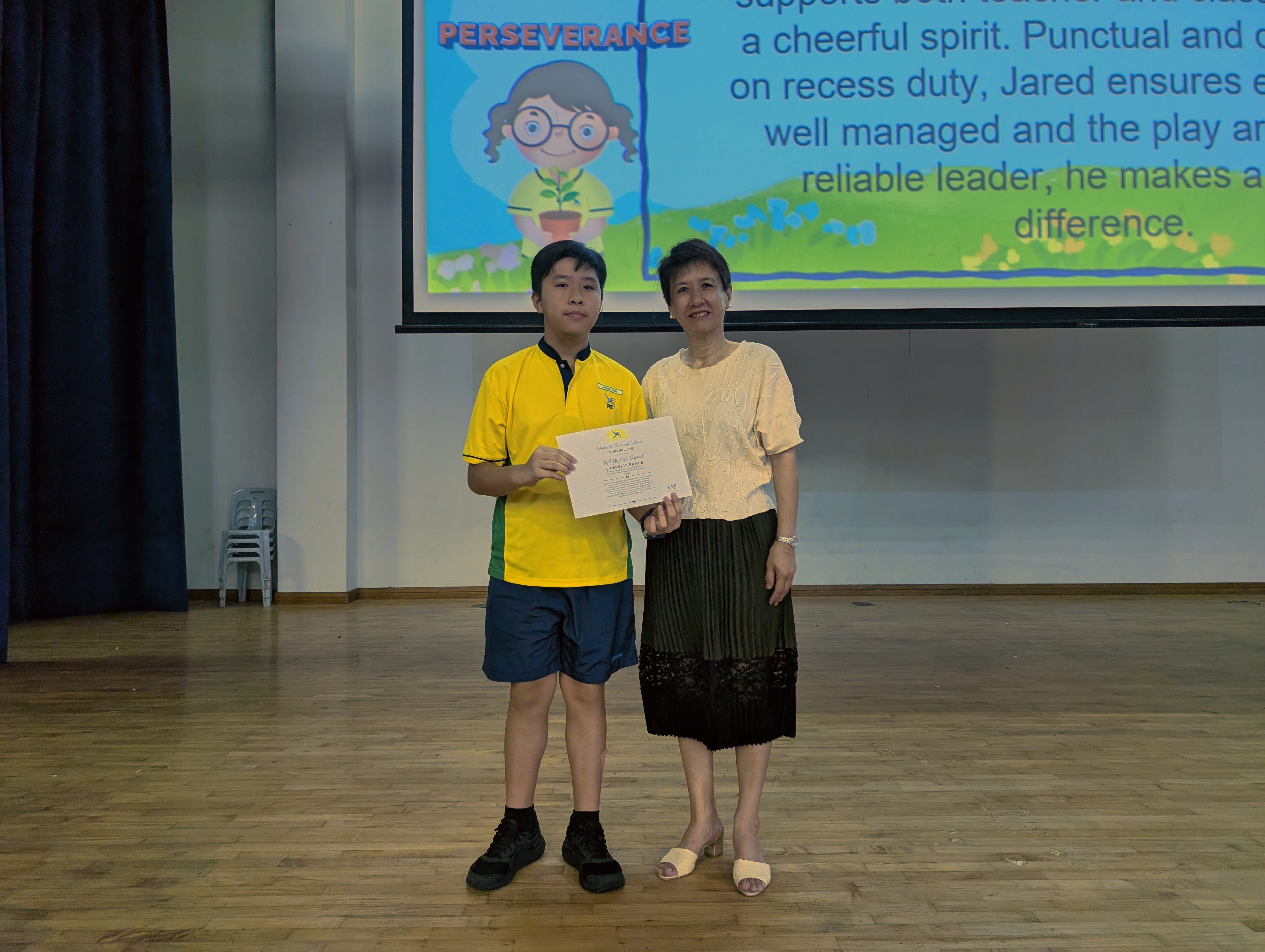  Jared receiving his certificate from Mrs Liang